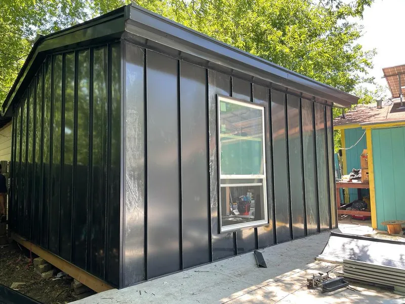 Black standing seam metal wall panels for Roof Inspection in Trophy Club